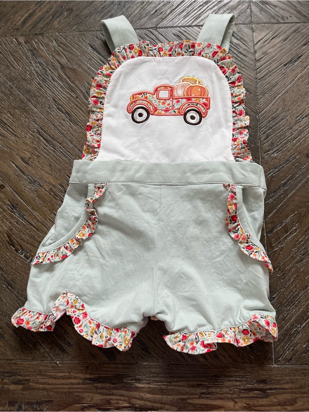 Sugar Dumplin Kids Short Overalls with Floral Ruffle and Pumpkin Truck